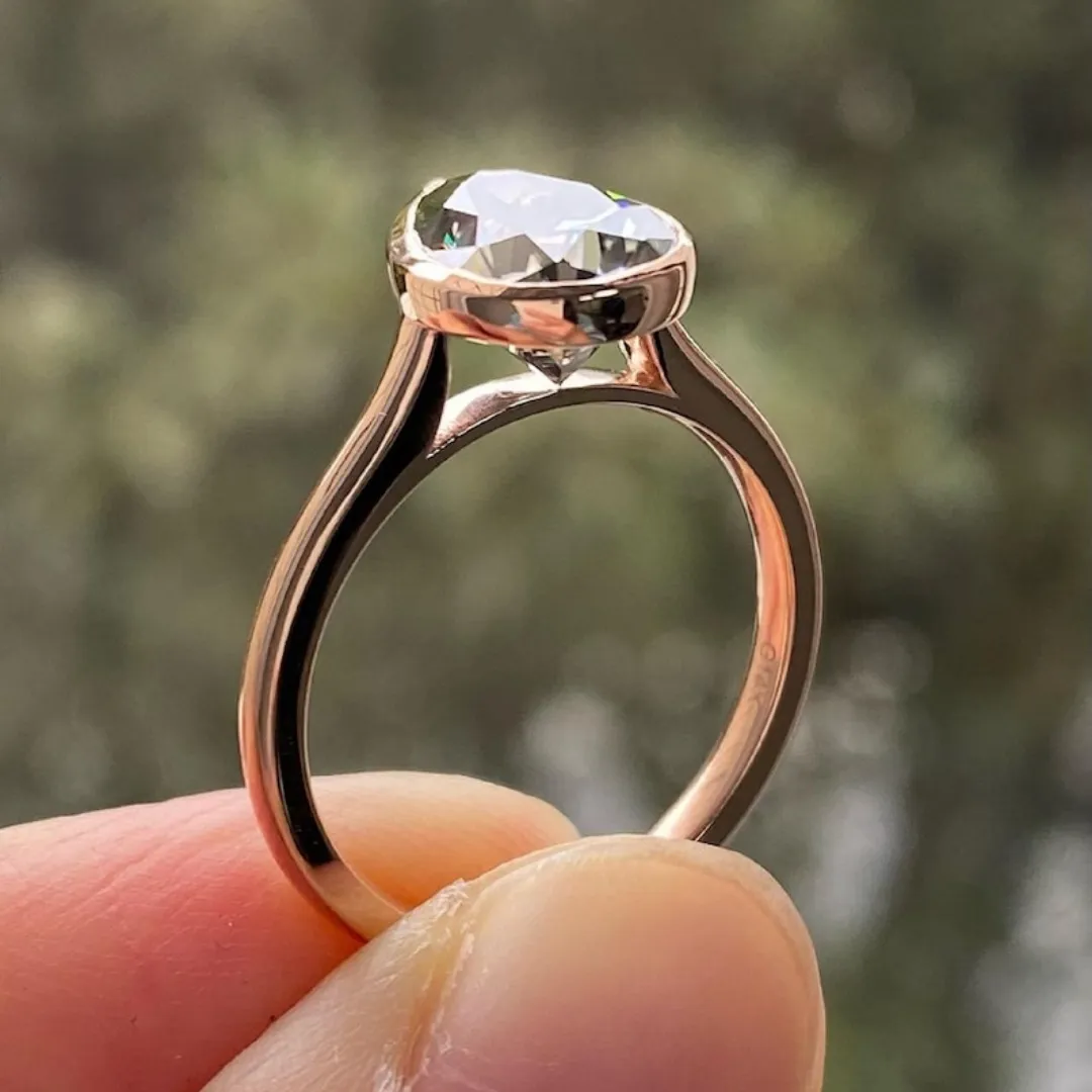 /public/photos/live/Singular Bezel Set Pear Solitaire Dark Grey Moissanite Ring 870 (4).webp